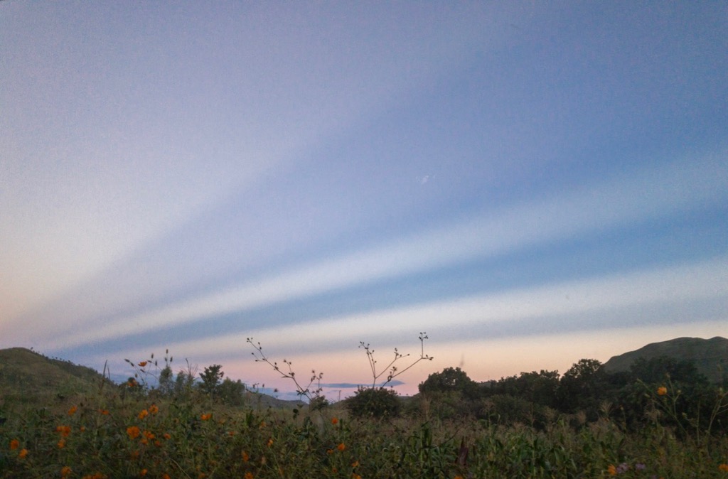 At sunset, the mountain tops painted these beautiful shadow stripes into the sky