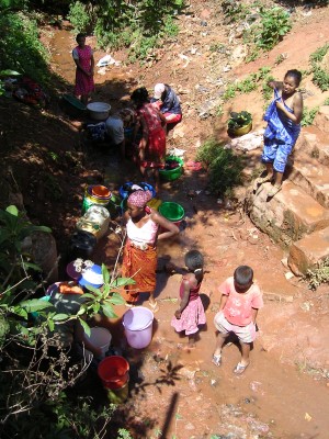 People waiting for their turn to get water