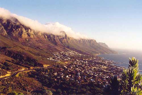 We climbed Lion’s Head to watch the sunset. This picture shows Table Mountain, one of the major tourist attractions. The clouds slowly came down the mountain. They looked like liquid oxygen.